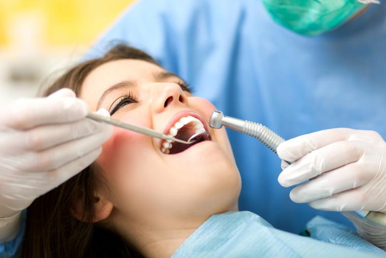 Dentist doing dental treatment